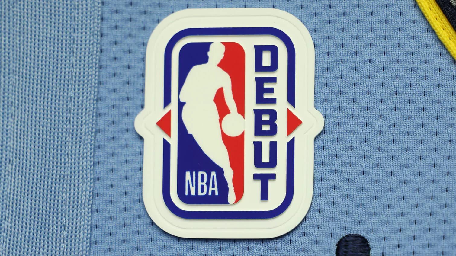 Players wearing NBA Debut and Gold Logoman patchesThe jersey patches will be inserted into 1-of-1 and ultra-rare trading cards from Topps this season.October 22, 2026